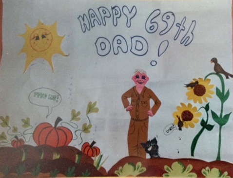 Birthday poster drawing of man and cat in garden